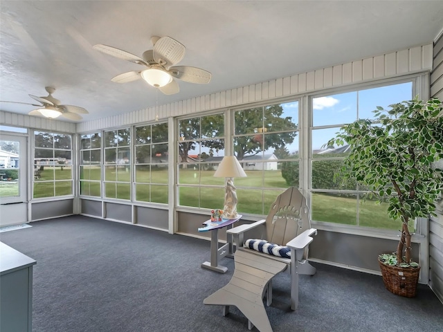 sunroom featuring a wealth of natural light and ceiling fan