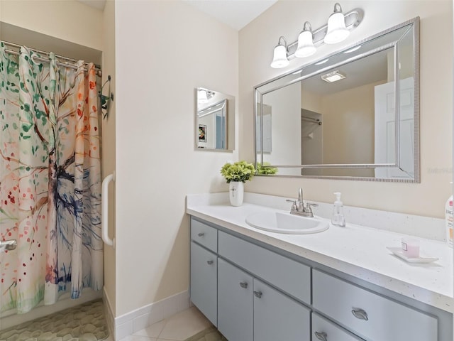 bathroom with tile patterned floors and vanity