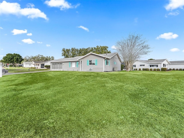 view of front of property with a garage and a front yard