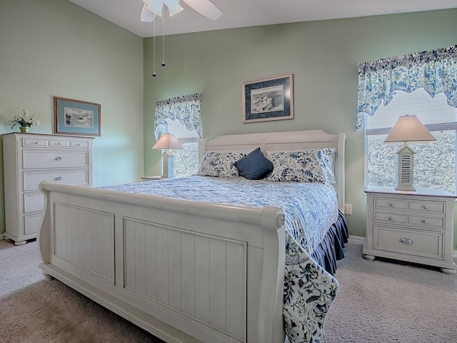 bedroom featuring lofted ceiling and light colored carpet