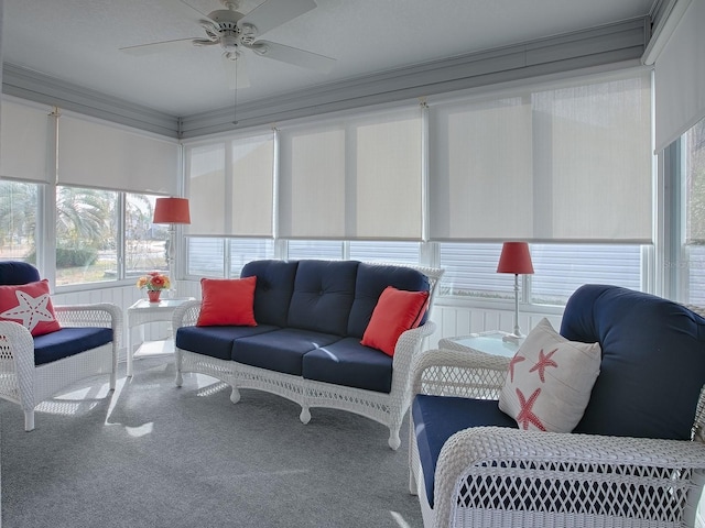 sunroom featuring ceiling fan