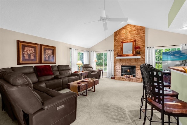 carpeted living room featuring ceiling fan, vaulted ceiling, and a brick fireplace