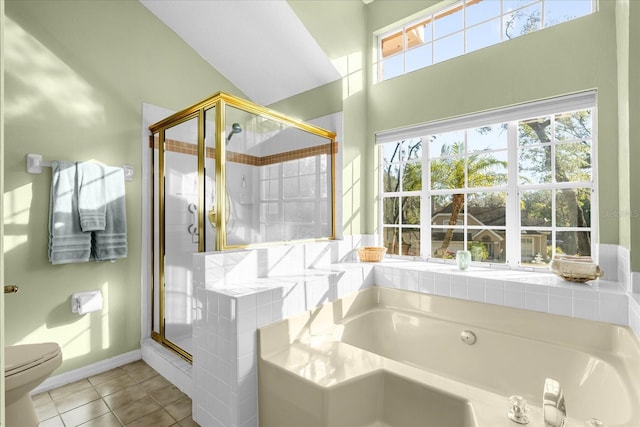 bathroom with plus walk in shower, tile patterned floors, and toilet