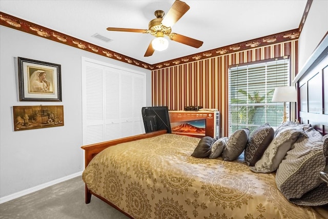 bedroom with carpet flooring, ceiling fan, and a closet