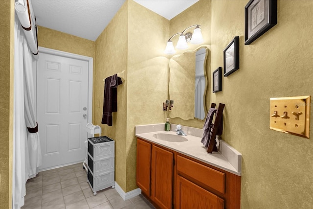 bathroom with tile patterned floors and vanity