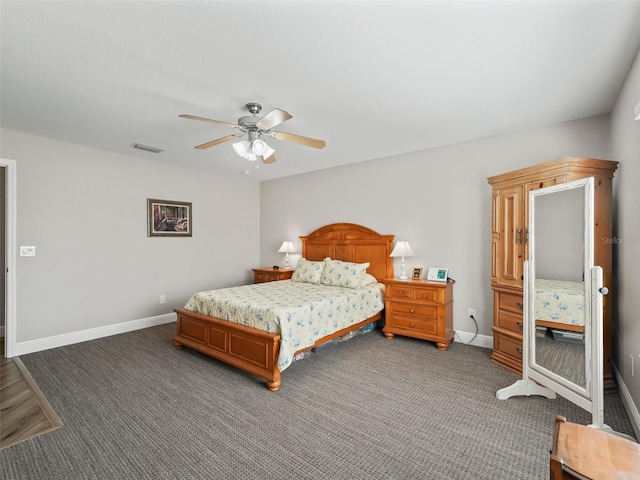 bedroom with dark colored carpet and ceiling fan