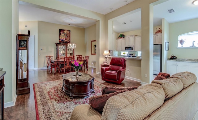 living room with dark hardwood / wood-style flooring