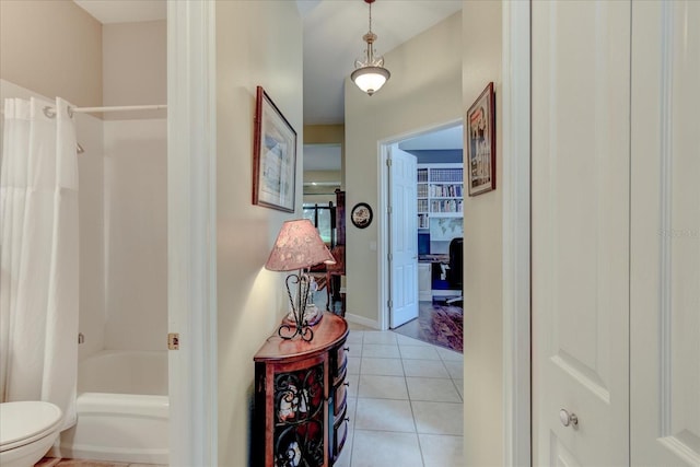 corridor with light tile patterned floors