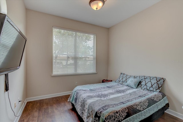 bedroom featuring dark wood-type flooring