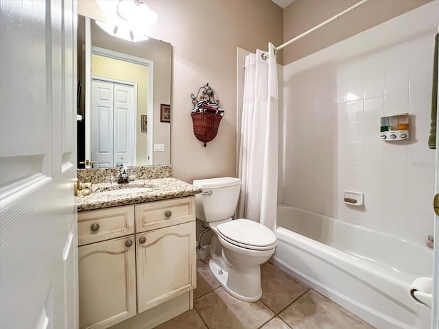 full bathroom featuring vanity, toilet, tile patterned flooring, and shower / tub combo