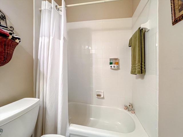 bathroom featuring toilet and shower / bath combo with shower curtain