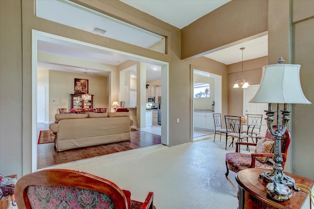 living room featuring a notable chandelier