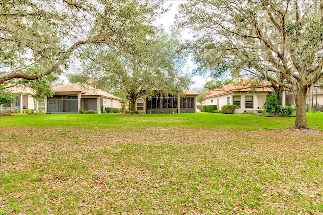 view of yard featuring a sunroom