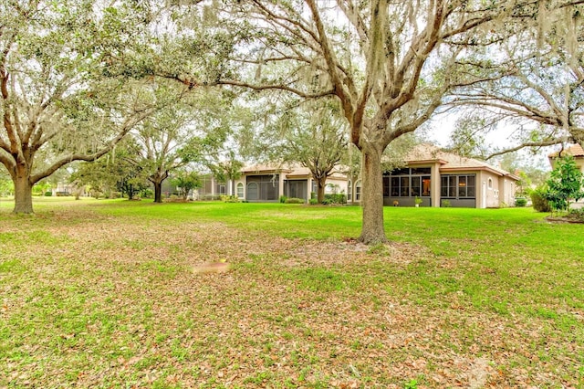 view of yard featuring a sunroom