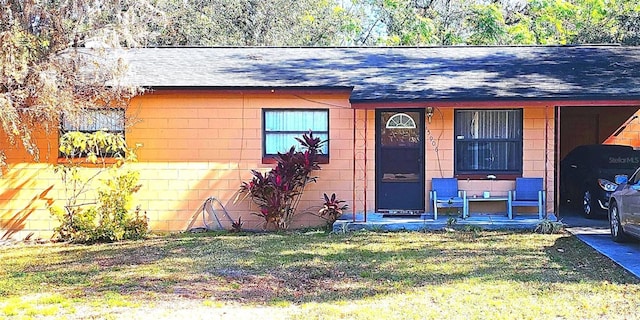 view of outbuilding featuring a yard