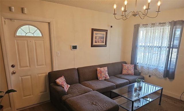 living room with an inviting chandelier and wood-type flooring