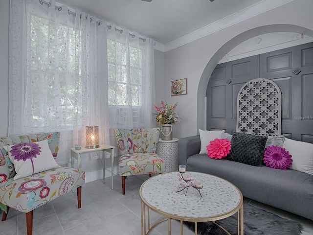 living room featuring crown molding and light tile patterned floors