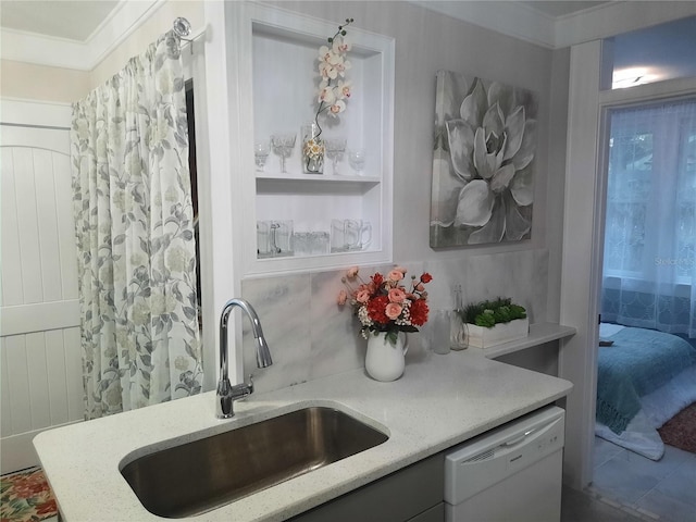 kitchen featuring sink, crown molding, white dishwasher, light stone countertops, and decorative backsplash