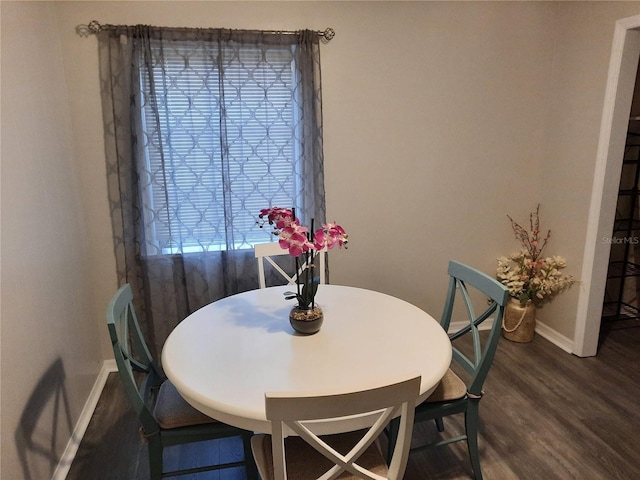 dining area with dark wood-type flooring