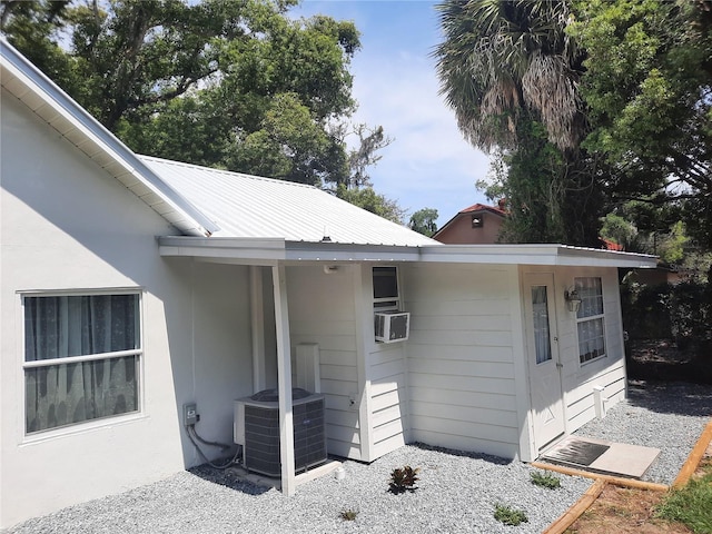 exterior space featuring cooling unit and central AC