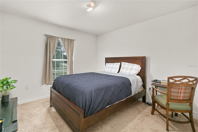 bedroom featuring light carpet