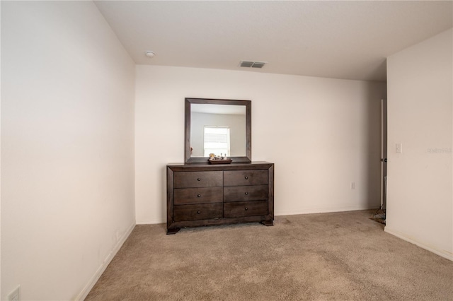 bedroom with light carpet