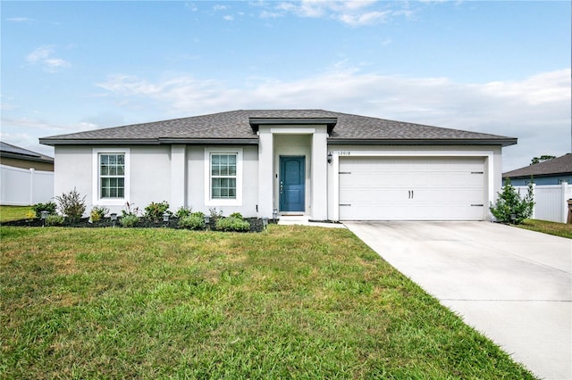 view of front of house featuring a garage and a front yard