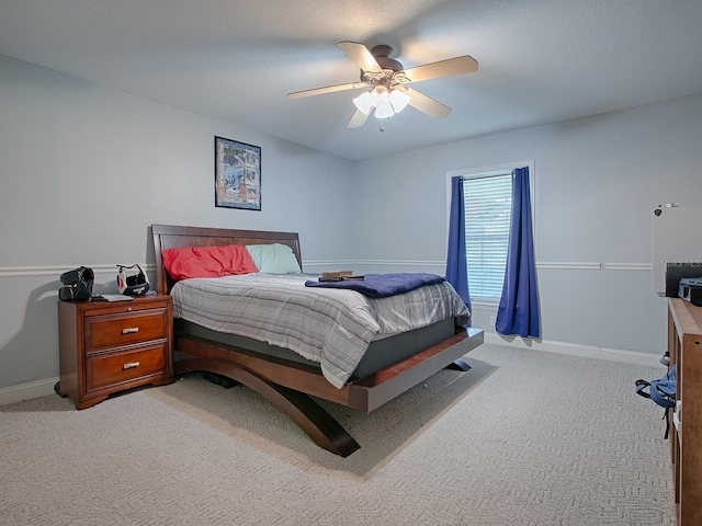 bedroom with light colored carpet and ceiling fan