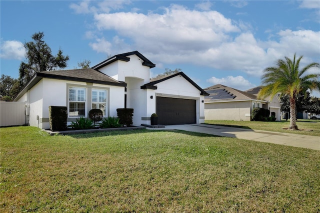 view of front of house with a garage and a front lawn