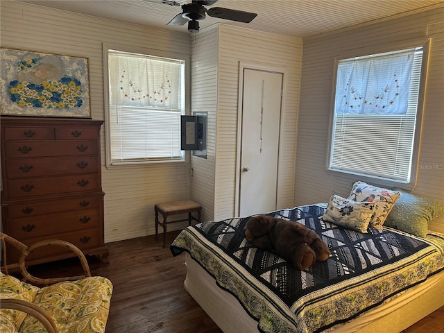 bedroom with ceiling fan and dark hardwood / wood-style floors