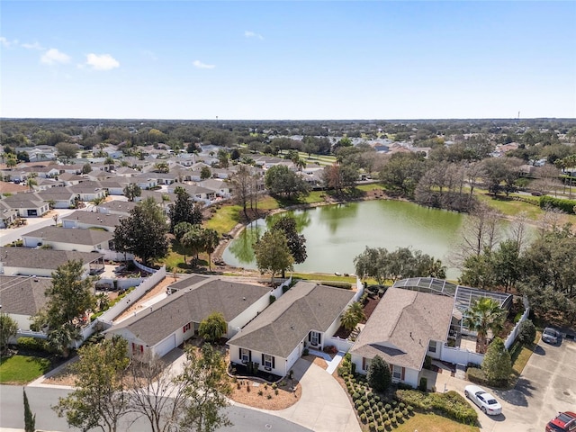 drone / aerial view with a residential view and a water view