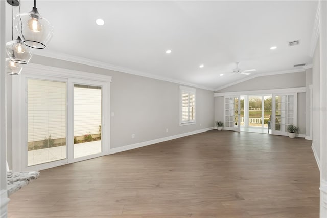 unfurnished living room with ornamental molding, light wood-style flooring, and visible vents