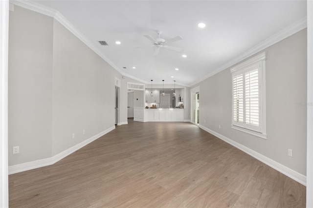 unfurnished living room featuring ceiling fan, visible vents, crown molding, and wood finished floors