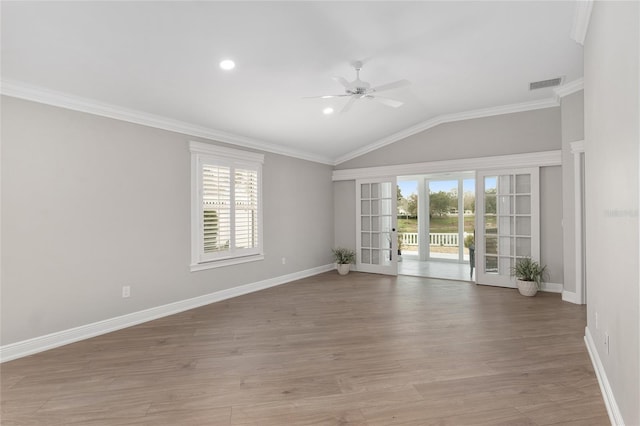 unfurnished room with baseboards, crown molding, visible vents, and light wood-style floors