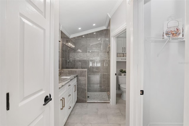 full bathroom with toilet, a spacious closet, a tile shower, crown molding, and vanity