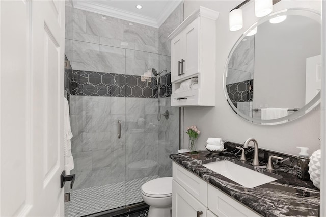 full bathroom with ornamental molding, a stall shower, vanity, and toilet