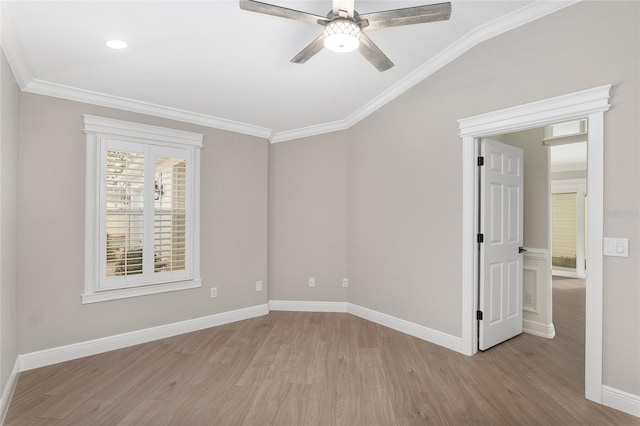 unfurnished room featuring light wood-style flooring, ornamental molding, and baseboards