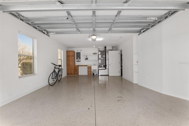 garage featuring a garage door opener and electric panel