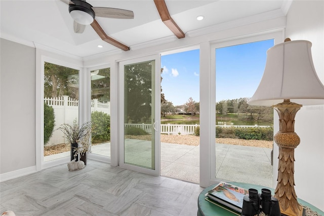 entryway with recessed lighting, beamed ceiling, a water view, and crown molding