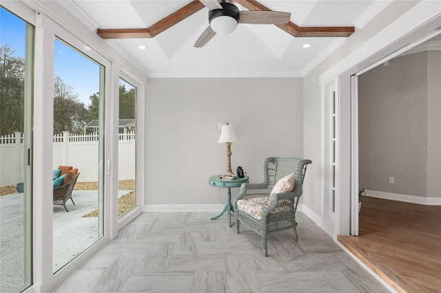 living area featuring baseboards, crown molding, and recessed lighting