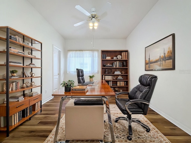 office featuring ceiling fan, lofted ceiling, and dark hardwood / wood-style floors