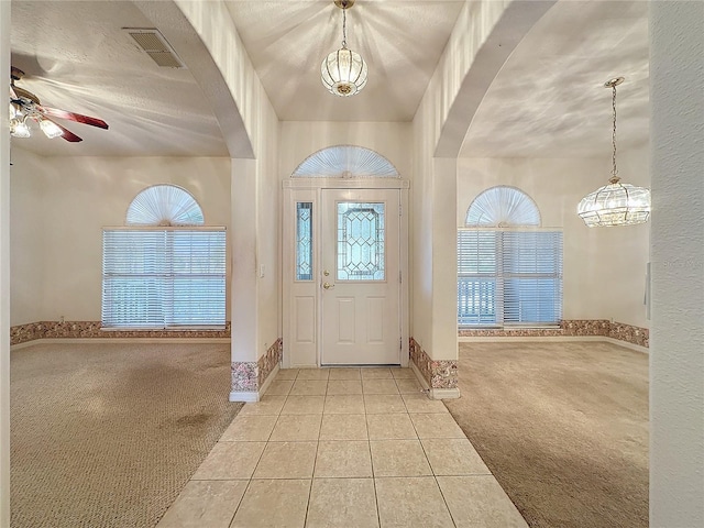 view of carpeted foyer