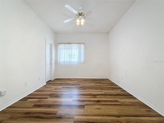 empty room featuring ceiling fan and dark hardwood / wood-style flooring