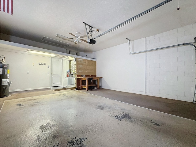 garage featuring a garage door opener and electric water heater