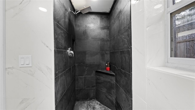 bathroom with a tile shower