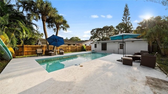 view of swimming pool featuring outdoor lounge area and a patio