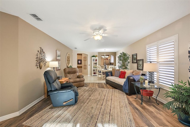 living room with hardwood / wood-style floors and ceiling fan