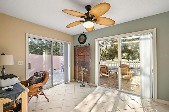 tiled office featuring ceiling fan