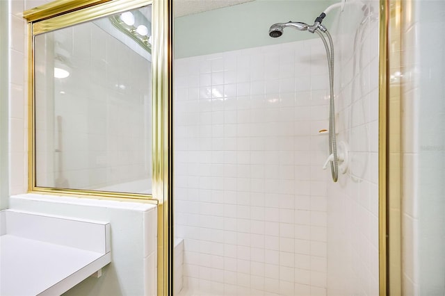bathroom with a shower with door