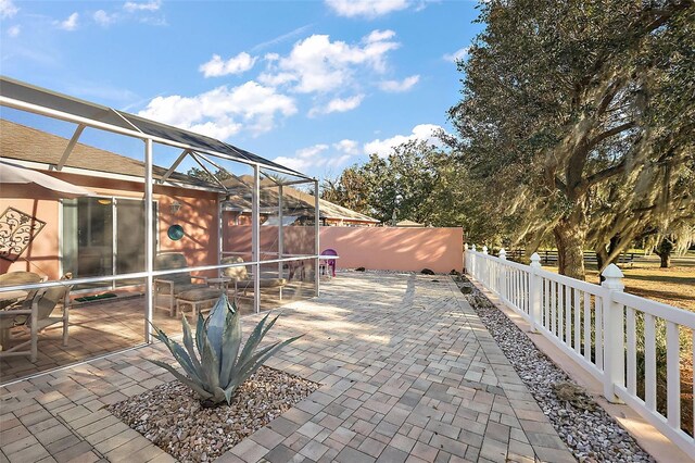 view of patio / terrace with a lanai